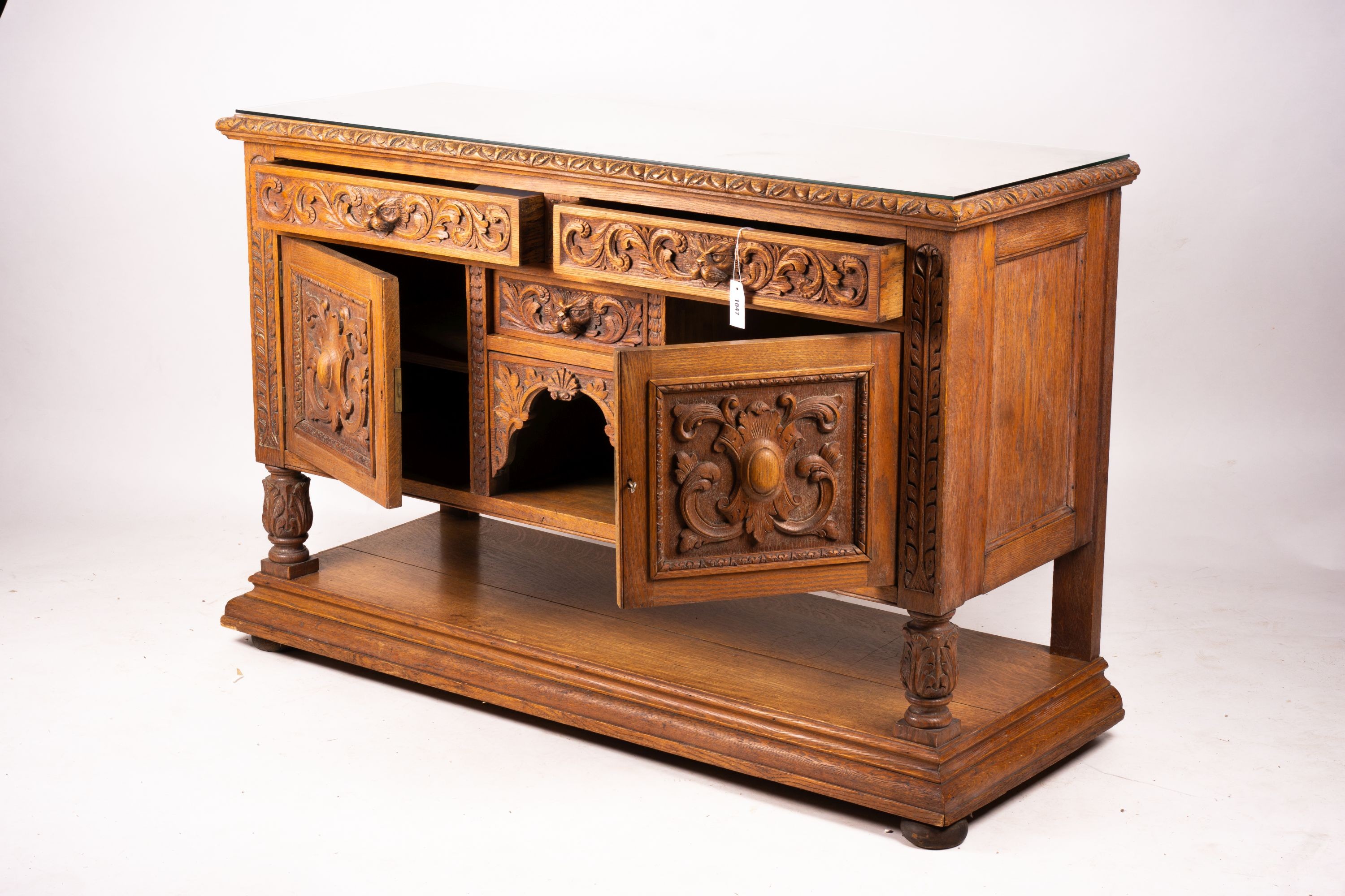 A late 19th century Flemish carved oak buffet, length 158cm, depth 58cm, height 99cm